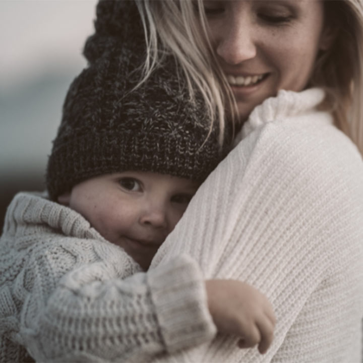 A mother holding a child