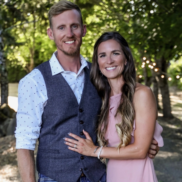 A picture of Brock and Jenny Jessup smiling as they stand together outside