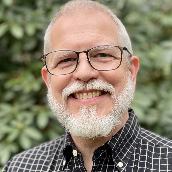 A picture of Marty Machowski smiling at the camera while standing outside