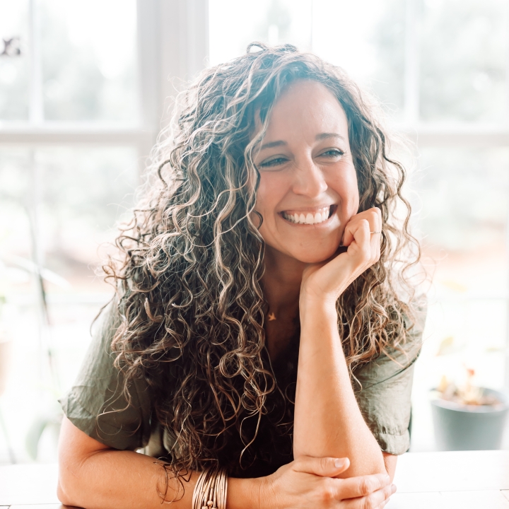 A picture of Meredith Steidler, the Bible2School Podcast Manager, smiling brightly at the camera