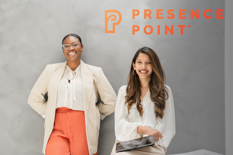 2 woman smiling the camera with the Presence Point logo